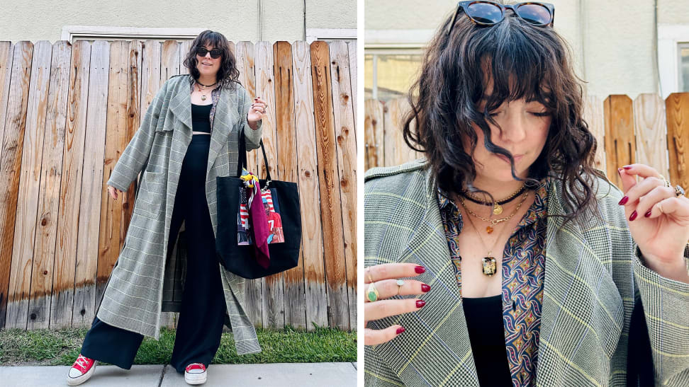 A woman wearing a plaid coat, wide-leg trousers, a plaid shirt, red Converse sneakers, a black tote bag and jewelry.